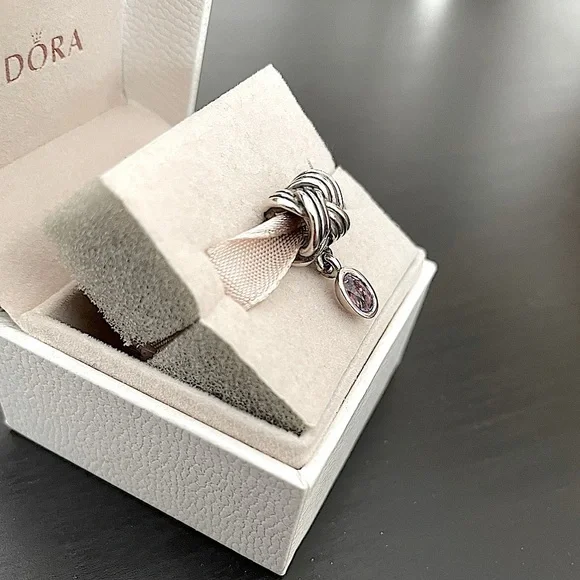 Pandora tied together charm